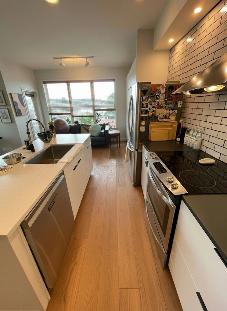 Galley kitchen with subway tile splashback after a deep clean