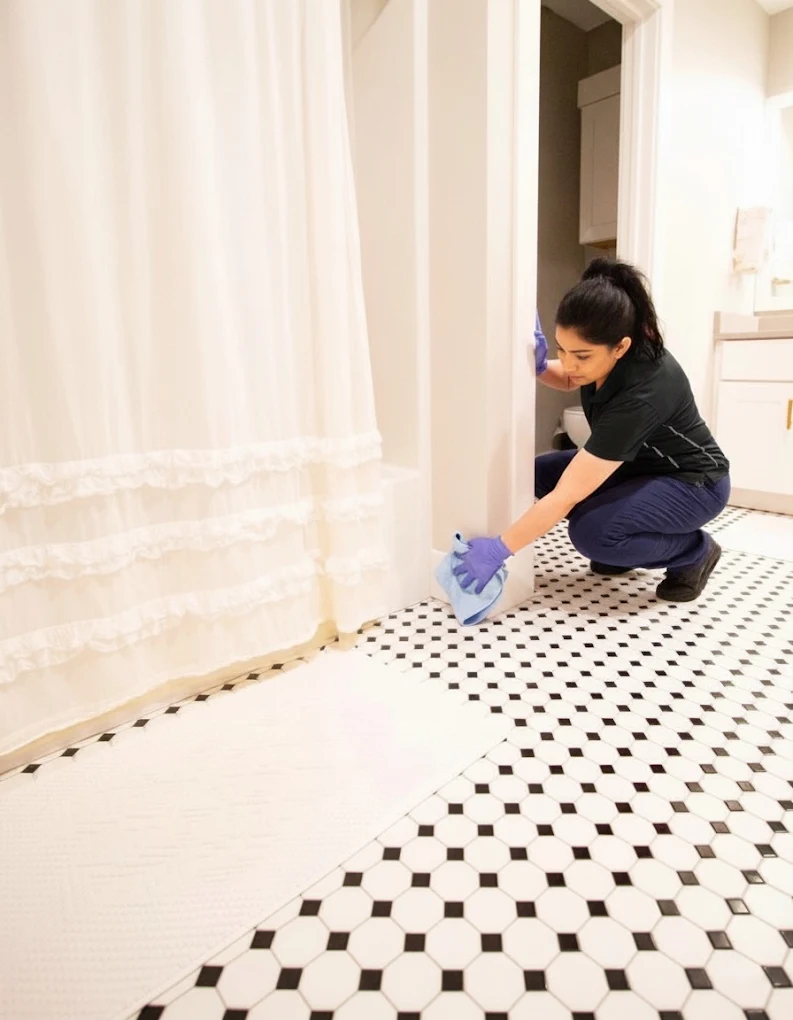 Cleaner detailing black and white mosaic bathroom floor tiles