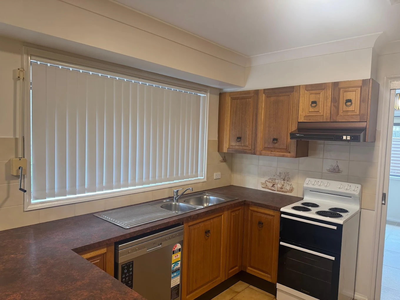 Timber kitchen cabinetry and benchtops cleaned for tenancy handover