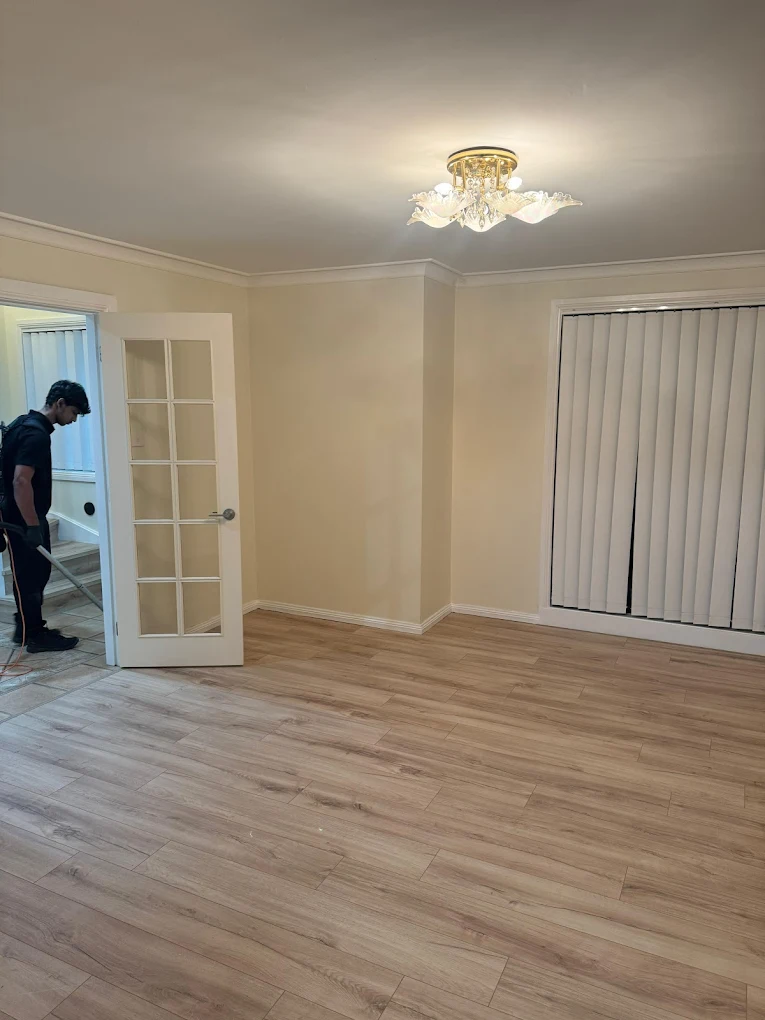 Empty living room with timber floors vacuumed and mopped for vacate clean
